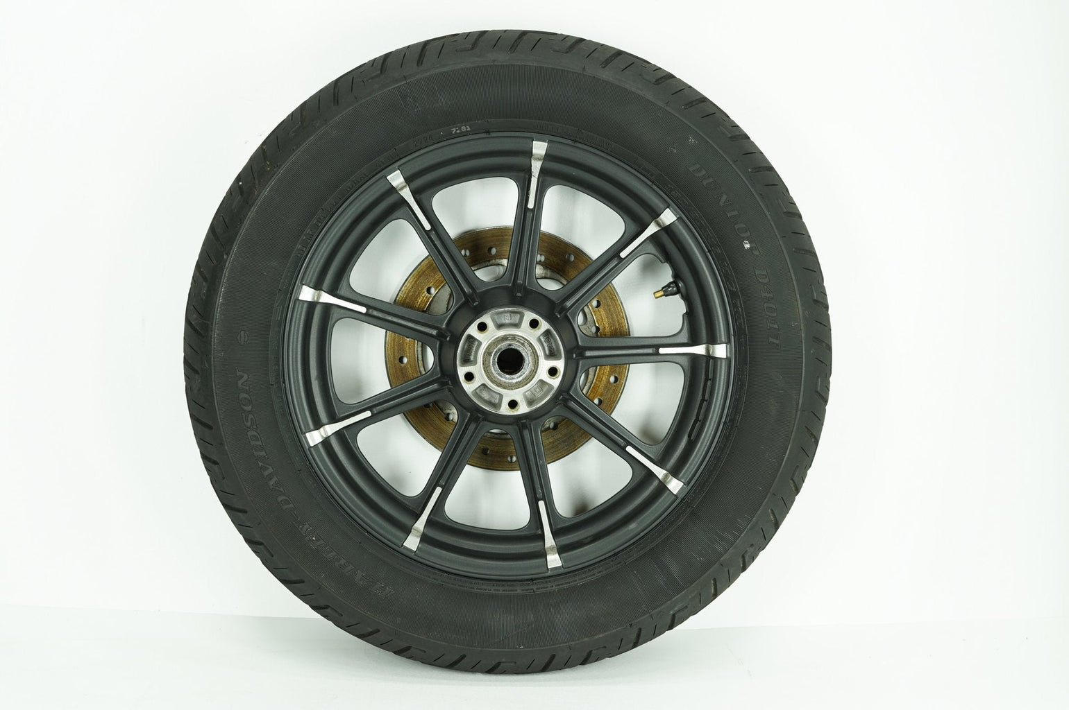 Used Harley-Davidson rear wheel rim and tire at Exclusive Harley Parts