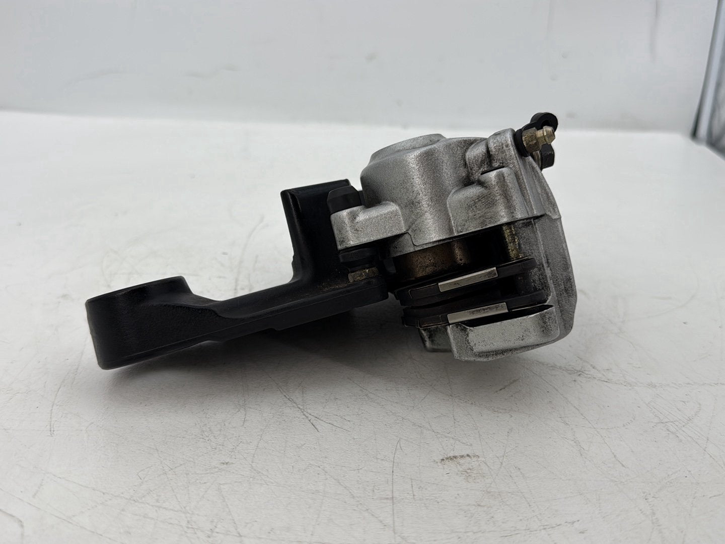 2006 Harley Sportster XL883C 883 Custom OEM Rear Back Brake Caliper w/ Bracket