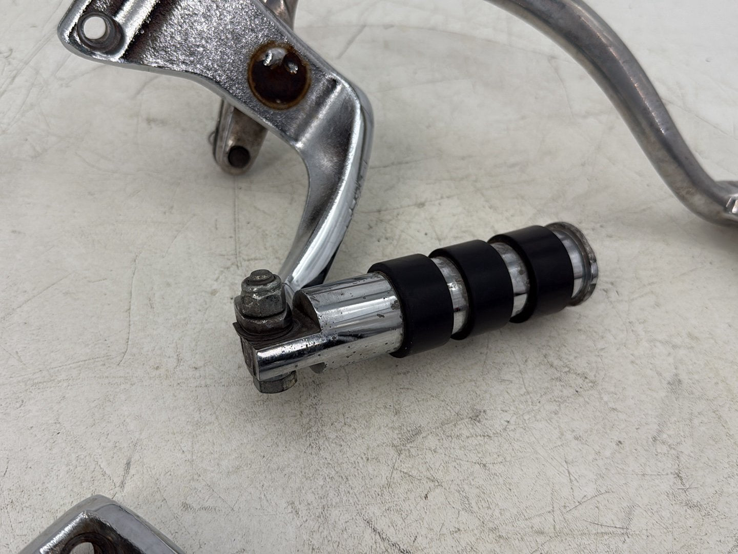 2015 Harley Dyna Low Rider FXDL OEM Right Driver Footpeg Bracket Mount