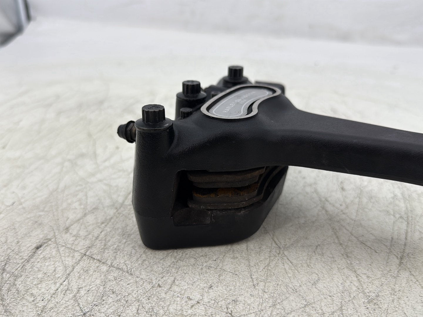 2004 Harley Dyna Super Glide FXDI OEM Rear Brake Caliper Bracket